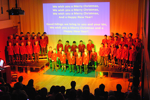 Year 4 students participating in a concert, showcasing their musical abilities and performing in front of an audience