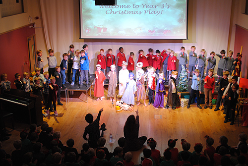 Year 3 students performing a play, showcasing their acting skills and teamwork in a theatrical production