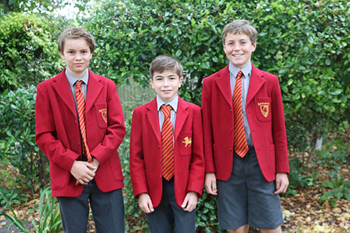 Three Moulsford students in red uniforms