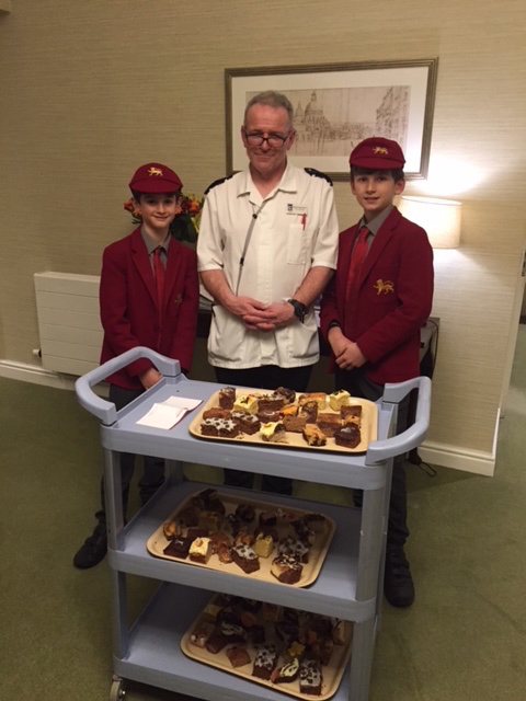 Two students and an adult presenting their cakes for Moulsford Cake Delivery Service