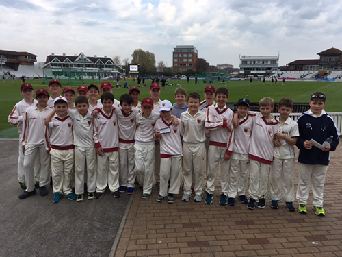 The school's colts cricket team on a cricket tour, enjoying the sport and competing against other teams in a friendly and spirited environment