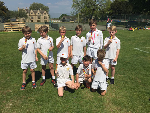 Students competing in a QuadKids event, demonstrating their skills in various track and field disciplines and enjoying a day of friendly competition